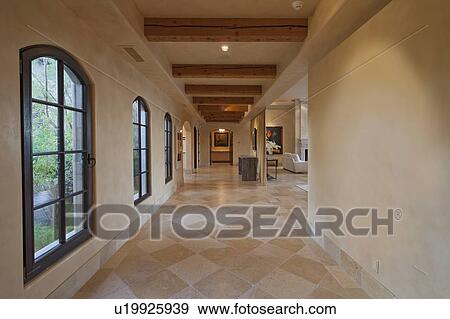Stock Photo - Empty hallway leading to living room. Fotosearch