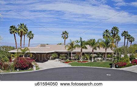 Stock Image - Facade of luxury country house. Fotosearch