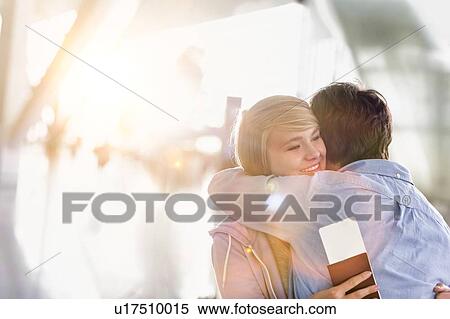 Father reuniting with his daughter in airport View Large Photo Image Stock Photography - Father reuniting with his daughter in airport. Fotosearch