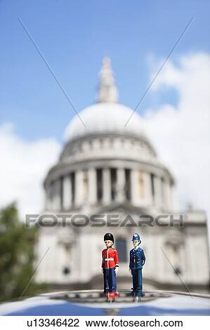 Figurines of London officers with St. Paul's Cathedral in background View Large Photo Image Stock Image - Figurines of London officers with St. Paul's Cathedral in background. Fotosearch