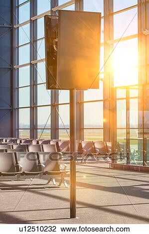 Stock Image - Flight display monitor in airport. Fotosearch