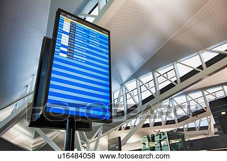 Stock Photo - Flight display monitor in airport. Fotosearch