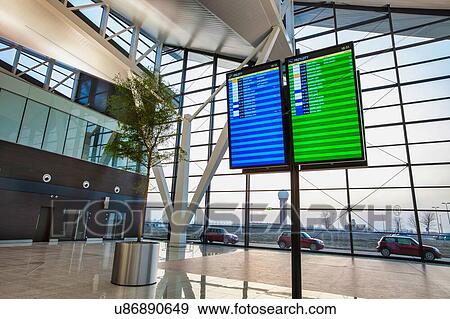 Stock Photo - Flight display monitor in airport. Fotosearch