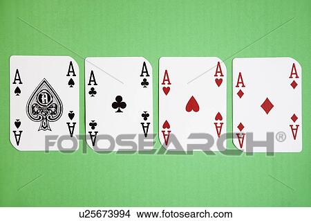 Four aces playing cards over green surface View Large Photo Image Picture - Four aces playing cards over green surface. Fotosearch