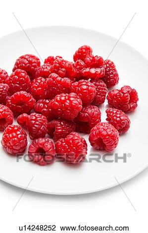 Stock Image - Fresh raspberries on plate. Fotosearch