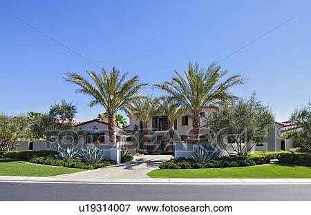 Stock Photo - Front view of luxurious villa. Fotosearch
