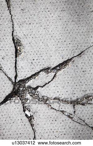 Stock Image - Full frame shot of cracked surface. Fotosearch