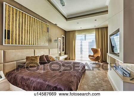 Stock Photo - Full length view of luxurious bedroom in new apartment. Fotosearch