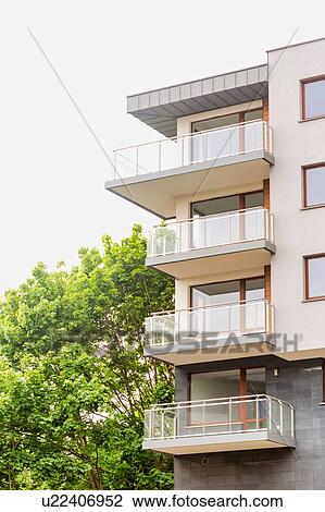 Stock Image - Full length view of rental apartment business. Fotosearch