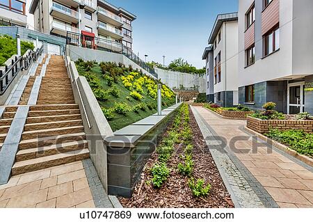 Stock Photo - Full length view of rental apartment business. Fotosearch