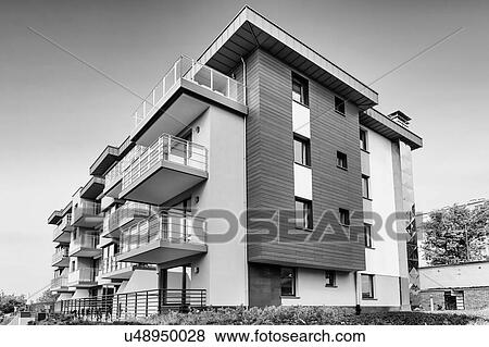 Stock Photo - Full length view of rental apartment business. Fotosearch