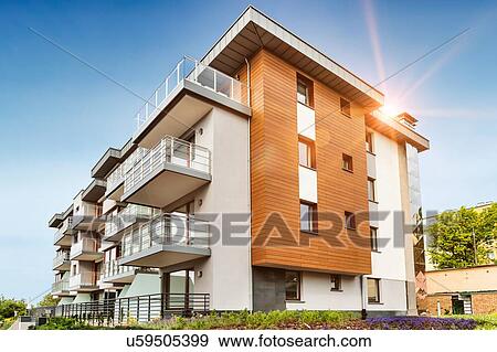 Stock Photo - Full length view of rental apartment business. Fotosearch