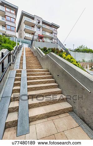 Stock Photo - Full length view of rental apartment business. Fotosearch