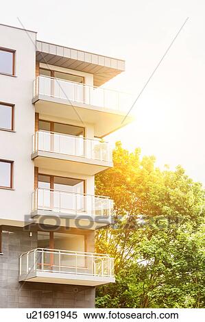 Stock Photography - Full length view of rental apartment business. Fotosearch