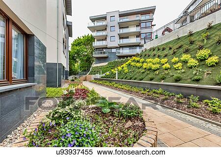 Stock Photography - Full length view of rental apartment business. Fotosearch