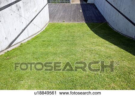 Grass verge between two brick walls View Large Photo Image Stock Image - Grass verge between two brick walls. Fotosearch