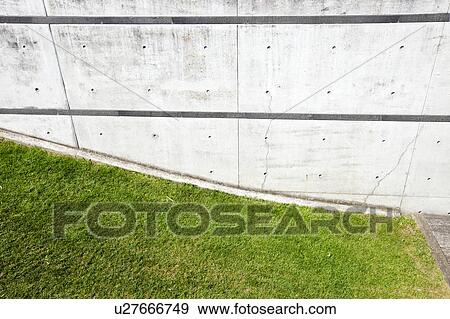 Grass verge next to brick wall View Large Photo Image Stock Photo - Grass verge next to brick wall. Fotosearch