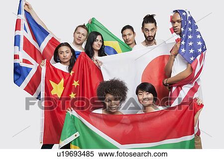 Group of multi-ethnic friends posing with various national flags against white background View Large Photo Image Stock Photography - Group of multi-ethnic friends posing with various national flags against white background. Fotosearch