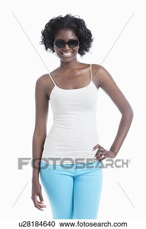 Happy young African American woman wearing sunglasses standing over white background View Large Photo Image Stock Image - Happy young African American woman wearing sunglasses standing over white background. Fotosearch