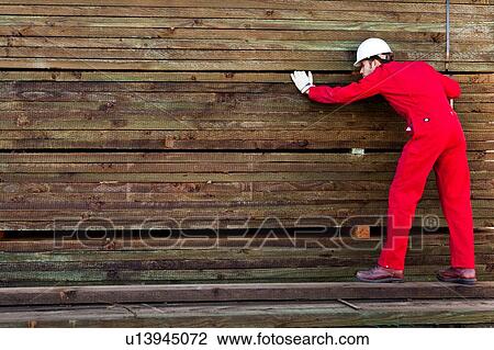 Hispanic worker inspecting timber wooden planks View Large Photo Image Stock Image - Hispanic worker inspecting timber wooden planks. Fotosearch