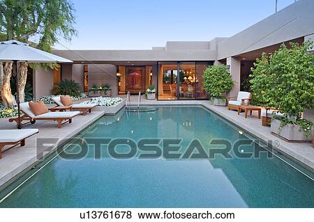 House exterior with pool at dusk View Large Photo Image Stock Photo - House exterior with pool at dusk. Fotosearch