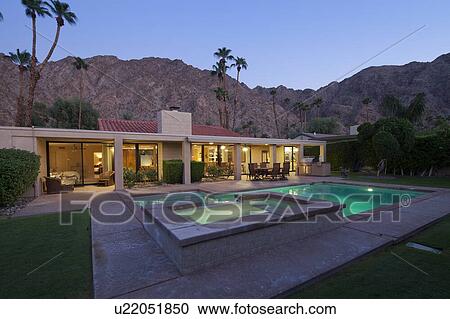 Stock Image - House Exterior with swimming pool. Fotosearch