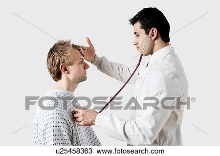 Indian male doctor checking the temperature of caucasian patient View Large Photo Image Stock Image - Indian male doctor checking the temperature of caucasian patient. Fotosearch