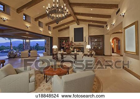 Interior of large open plan living room opening to patio View Large Photo Image Picture - Interior of large open plan living room opening to patio. Fotosearch