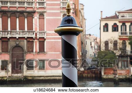 Picture - Italy Venice focus on pole by canal. Fotosearch