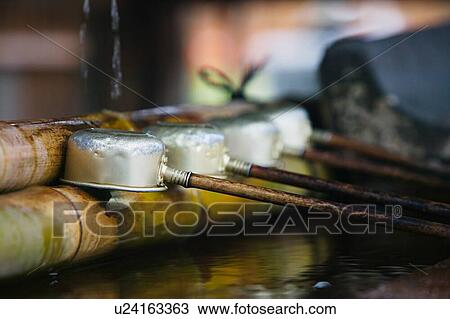 Stock Image - Japan Nara Kofuku-ji Temple Row of ladles close-up. Fotosearch