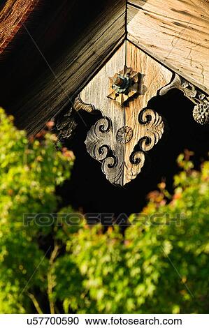 Stock Image - Japanese wooden temple with plants. Fotosearch