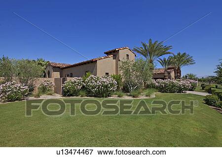 Lawn in backyard of luxury villa View Large Photo Image Stock Photo - Lawn in backyard of luxury villa. Fotosearch