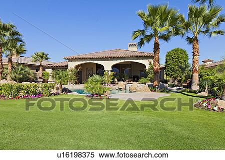 Stock Photography - Lawn in front of luxury mansion. Fotosearch