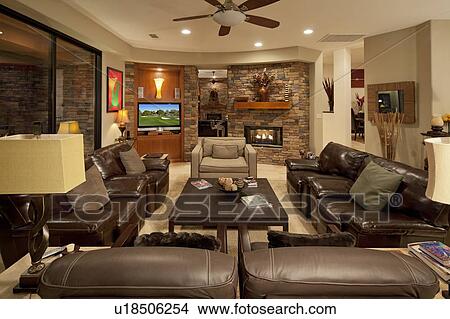 Picture - Leather seating furniture in living room of luxury mansion. Fotosearch