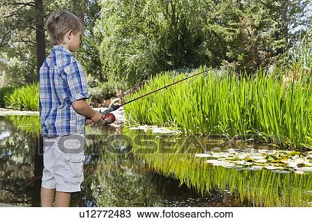 Little boy fishing at lake View Large Photo Image Stock Image - Little boy fishing at lake. Fotosearch