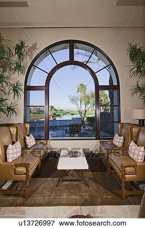 Stock Photo - Living room interior with seating furniture near window. Fotosearch