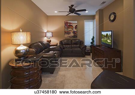 Living room with flat panel monitor television in manor house View Large Photo Image Stock Image - Living room with flat panel monitor television in manor house. Fotosearch