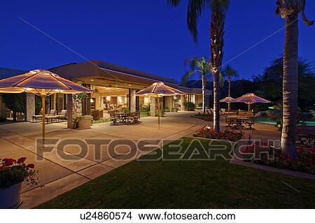 Looking over patio to outdoor seating area of luxury home View Large Photo Image Picture - Looking over patio to outdoor seating area of luxury home. Fotosearch