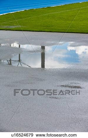 Stock Photo - Low angle view wet floor in stadium. Fotosearch