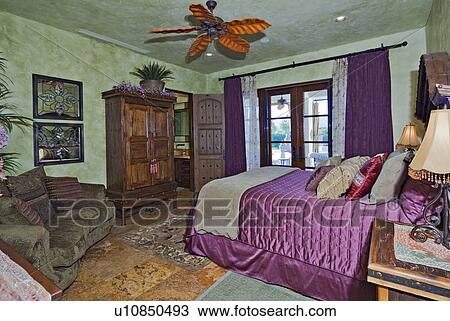 Stock Image - Luxurious bedroom interior design in mansion. Fotosearch