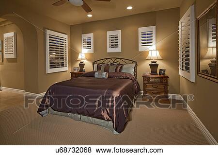 Luxurious bedroom with comfortable bed in mansion View Large Photo Image Stock Photo - Luxurious bedroom with comfortable bed in mansion. Fotosearch