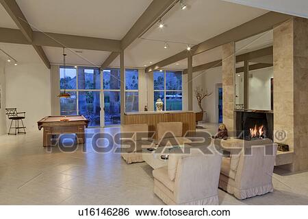 Stock Photograph - Luxurious living area with billiard table. Fotosearch