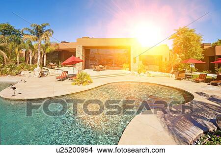 Luxurious swimming pool outside villa View Large Photo Image Picture - Luxurious swimming pool outside villa. Fotosearch
