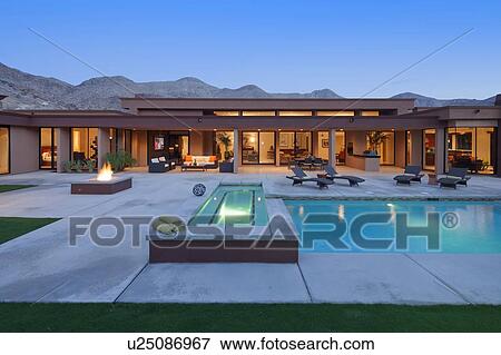 Stock Photo - Luxury House Exterior with swimming pool. Fotosearch