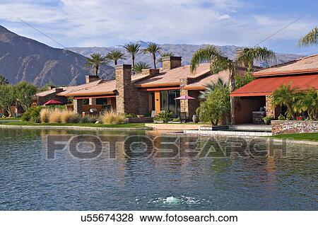Luxury manor house with lake in foreground View Large Photo Image Stock Photo - Luxury manor house with lake in foreground. Fotosearch