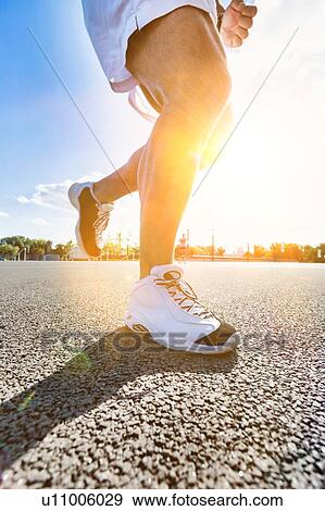 Stock Photo - Man running on marathon. Fotosearch