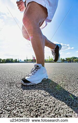 Stock Photo - Man running on marathon. Fotosearch