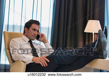 Mature businessman talking on smartphone View Large Photo Image Stock Image - Mature businessman talking on smartphone. Fotosearch
