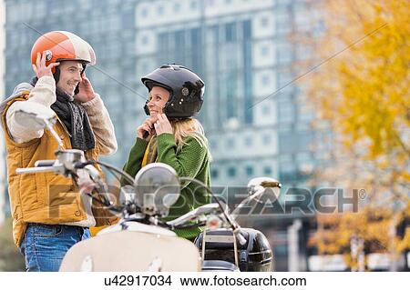 Picture - Mature couple walking in park in Autumn. Fotosearch