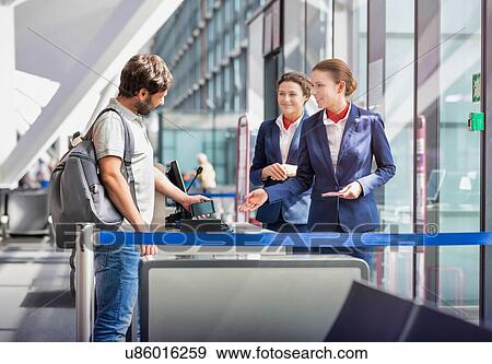 Mature man on board scanning her ticket on smartphone in airport View Large Photo Image Stock Photo - Mature man on board scanning her ticket on smartphone in airport. Fotosearch